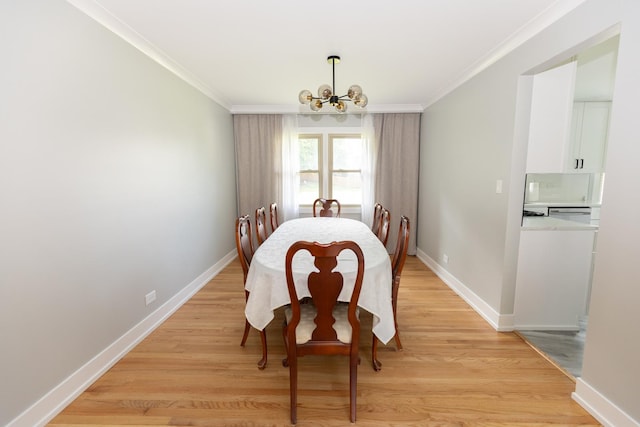3145 Hillside Ln, Darien, IL 60561 - dining area with a chandelier, ornamental molding, and light wood-style flooring