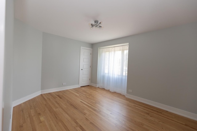 3145 Hillside Ln, Darien, IL 60561 - spare room featuring light wood-style floors and baseboards