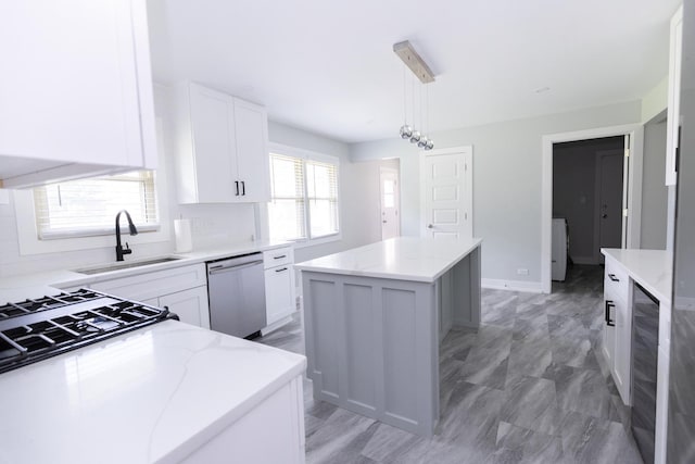 3145 Hillside Ln, Darien, IL 60561 - kitchen with dishwasher, a kitchen island, light stone counters, and white cabinets