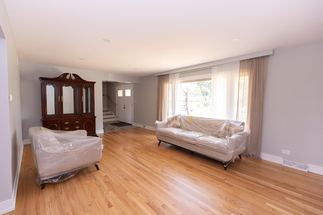 3145 Hillside Ln, Darien, IL 60561 - living area featuring stairway and light wood-style floors