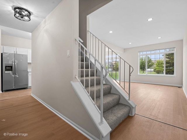 18506 Bellagio Cir, Tinley Park, IL 60477 - stairs with wood finished floors and recessed lighting