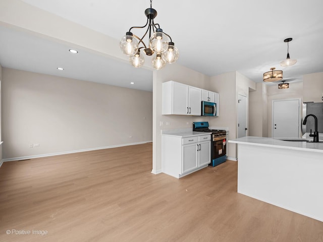 18506 Bellagio Cir, Tinley Park, IL 60477 - kitchen with stainless steel appliances, light wood-type flooring, white cabinets, light countertops, and decorative light fixtures