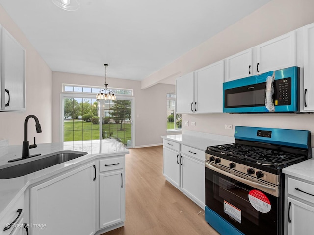 18506 Bellagio Cir, Tinley Park, IL 60477 - kitchen with appliances with stainless steel finishes, light wood-style flooring, white cabinets, and light countertops