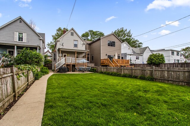 4039 N Kildare Ave, Chicago, IL 60641 - rear view of house featuring a fenced backyard, a patio area, a wooden deck, and stairs