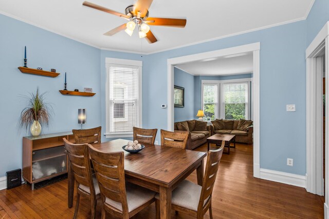 4039 N Kildare Ave, Chicago, IL 60641 - dining space featuring wood finished floors, a ceiling fan, and ornamental molding