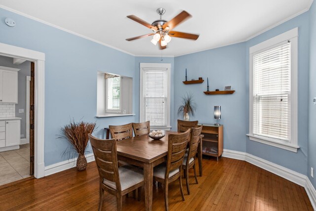 4039 N Kildare Ave, Chicago, IL 60641 - dining area featuring a ceiling fan, light wood-style flooring, and ornamental molding