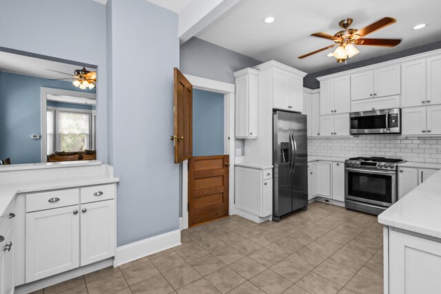 4039 N Kildare Ave, Chicago, IL 60641 - kitchen with stainless steel appliances, a ceiling fan, tasteful backsplash, white cabinets, and recessed lighting