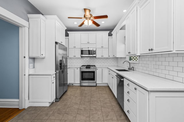 4039 N Kildare Ave, Chicago, IL 60641 - kitchen with appliances with stainless steel finishes, ceiling fan, tasteful backsplash, white cabinetry, and recessed lighting