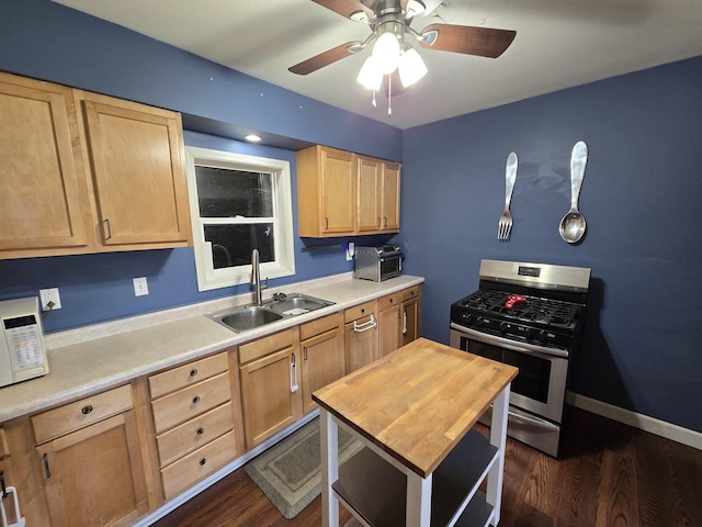 16517 Plainview Dr, Markham, IL 60428 - kitchen with a sink, stainless steel gas range, light brown cabinets, white microwave, and a ceiling fan