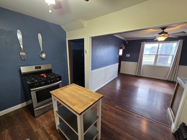 16517 Plainview Dr, Markham, IL 60428 - kitchen featuring gas stove, a ceiling fan, wainscoting, dark wood finished floors, and arched walkways