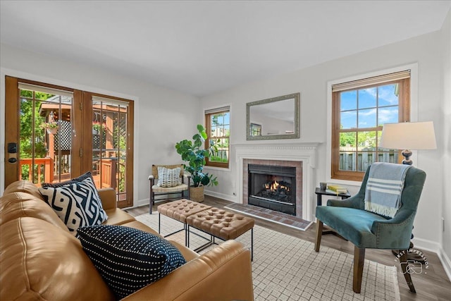 957 Whittington Dr, Geneva, IL 60134 - living area featuring healthy amount of natural light, a lit fireplace, and wood finished floors