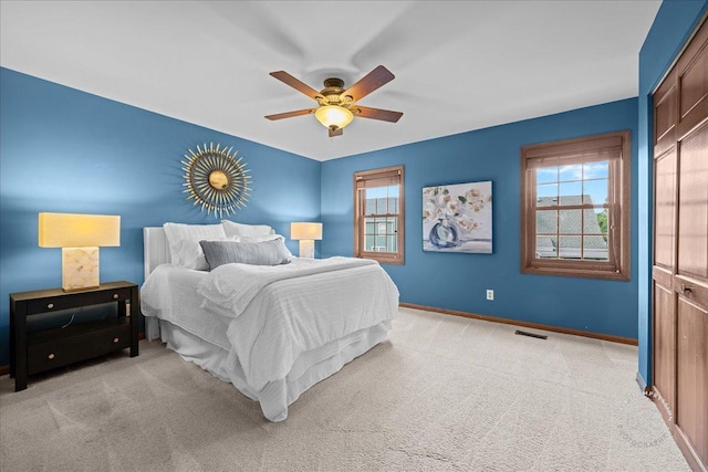 957 Whittington Dr, Geneva, IL 60134 - bedroom with multiple windows, light carpet, and a ceiling fan