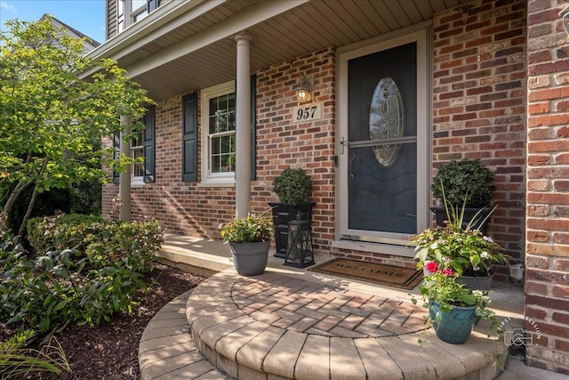 957 Whittington Dr, Geneva, IL 60134 - doorway to property with brick siding and covered porch