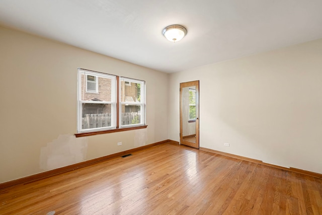 2728 N Neva Ave, Chicago, IL 60707 - unfurnished room with light wood finished floors and baseboards