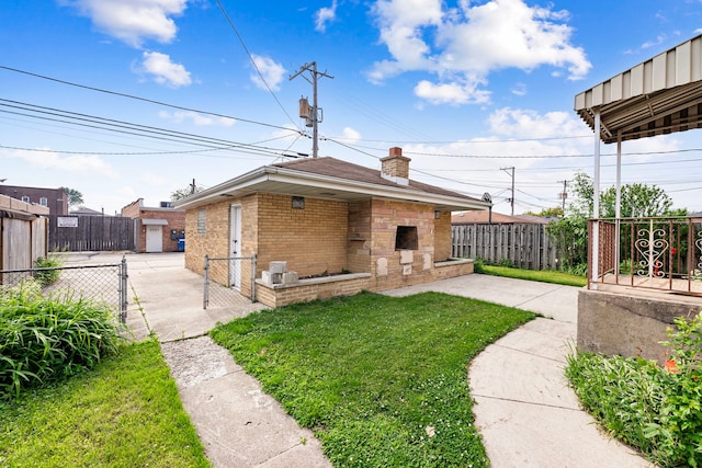 2728 N Neva Ave, Chicago, IL 60707 - back of property with brick siding, a chimney, a fenced backyard, a patio area, and an outbuilding
