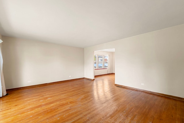 2728 N Neva Ave, Chicago, IL 60707 - empty room featuring light wood-style floors and baseboards