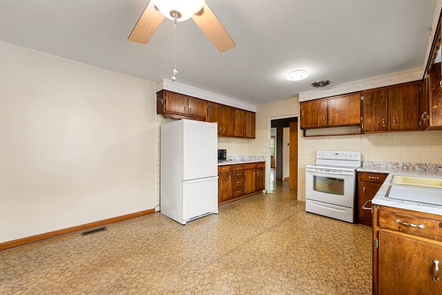 2728 N Neva Ave, Chicago, IL 60707 - kitchen featuring white appliances, light countertops, decorative backsplash, ceiling fan, and light flooring