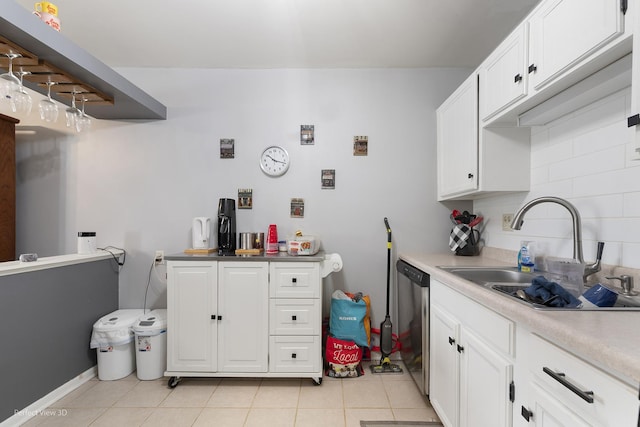 6266 Trinity Dr Unit 2B, Lisle, IL 60532 - kitchen featuring a sink, stainless steel dishwasher, white cabinetry, and light tile patterned floors