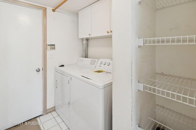 377 Locksley Dr, Streamwood, IL 60107 - laundry area with washer and dryer, cabinet space, and light tile patterned floors