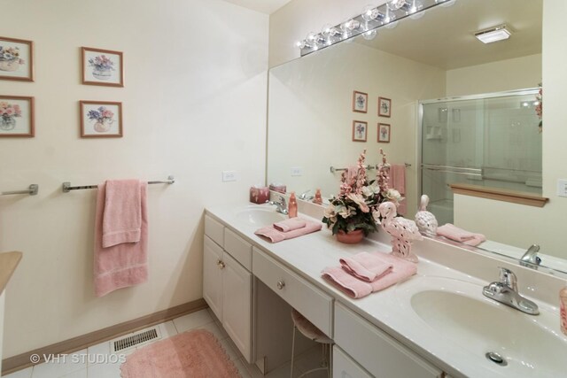377 Locksley Dr, Streamwood, IL 60107 - bathroom with double vanity, a shower stall, and tile patterned flooring