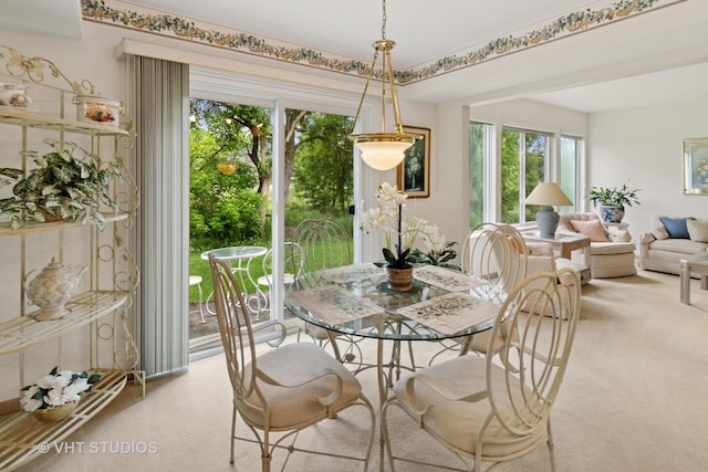 377 Locksley Dr, Streamwood, IL 60107 - dining room with carpet floors and plenty of natural light