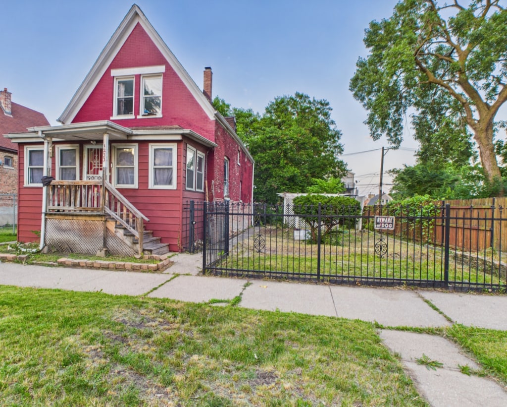 1233 S Karlov Ave, Chicago, IL 60623 - view of front facade with a chimney and covered porch