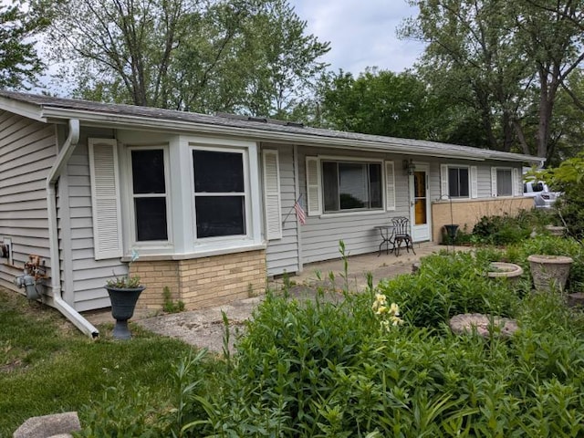 7202 Edgebrook Ln, Hanover Park, IL 60133 - view of front facade featuring a patio and brick siding