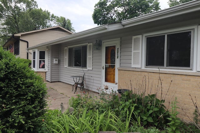 7202 Edgebrook Ln, Hanover Park, IL 60133 - view of front facade with brick siding and a patio area