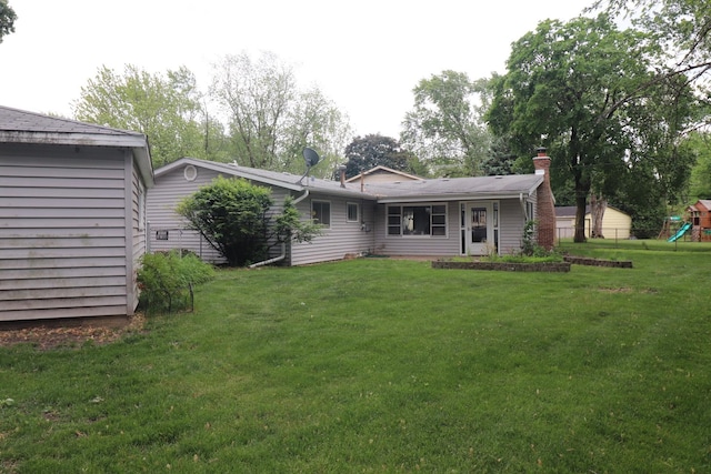 7202 Edgebrook Ln, Hanover Park, IL 60133 - back of property featuring a playground and a chimney