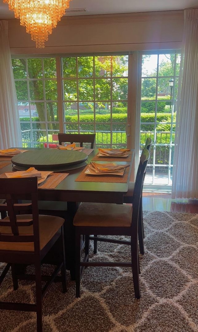3427 Vollmer Rd Unit 108, Flossmoor, IL 60422 - dining area featuring a chandelier and healthy amount of natural light