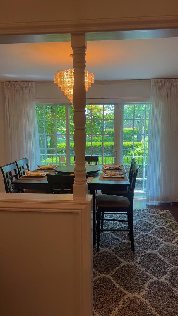 3427 Vollmer Rd Unit 108, Flossmoor, IL 60422 - dining room with a chandelier
