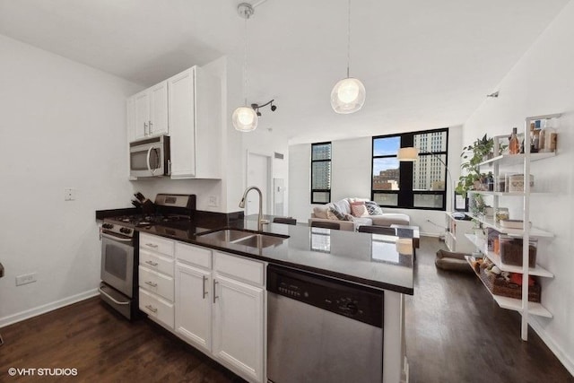 1255 S State St Unit 911, Chicago, IL 60605 - kitchen featuring stainless steel appliances, a sink, dark wood-type flooring, a peninsula, and white cabinetry