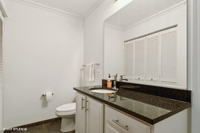1255 S State St Unit 911, Chicago, IL 60605 - bathroom with toilet, vanity, ornamental molding, tile patterned floors, and baseboards
