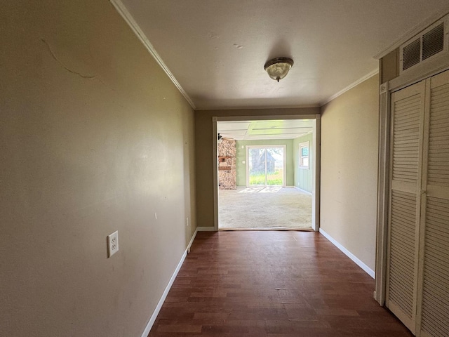 310 N 3rd Ave, Chenoa, IL 61726 - hallway with ornamental molding, wood finished floors, and baseboards