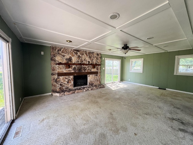 310 N 3rd Ave, Chenoa, IL 61726 - unfurnished living room with a fireplace, plenty of natural light, coffered ceiling, carpet floors, and baseboards