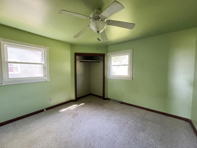 310 N 3rd Ave, Chenoa, IL 61726 - unfurnished bedroom featuring carpet flooring, a closet, and baseboards