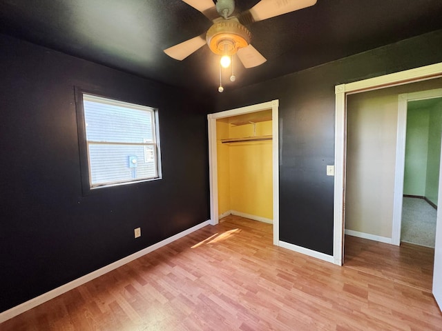 310 N 3rd Ave, Chenoa, IL 61726 - unfurnished bedroom featuring light wood-type flooring, baseboards, and ceiling fan