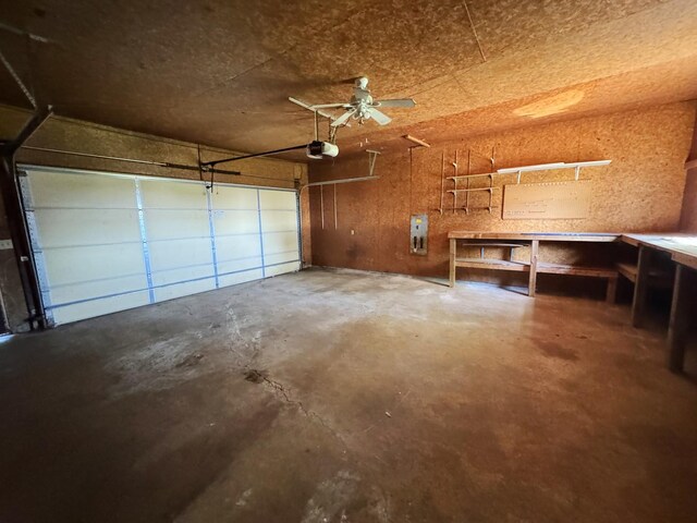 310 N 3rd Ave, Chenoa, IL 61726 - garage featuring a garage door opener, a ceiling fan, and a workshop area