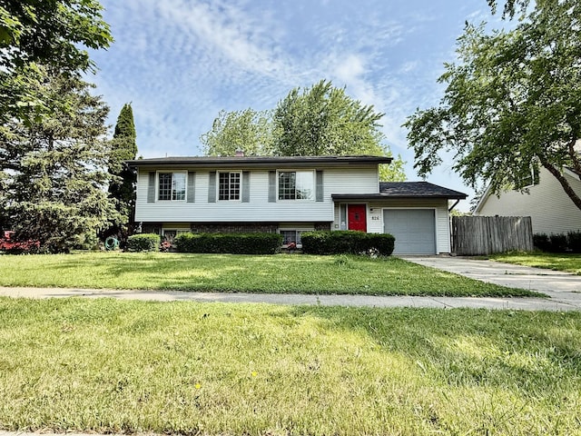 826 Dartmoor Dr, Crystal Lake, IL 60014 - split level home featuring an attached garage and concrete driveway