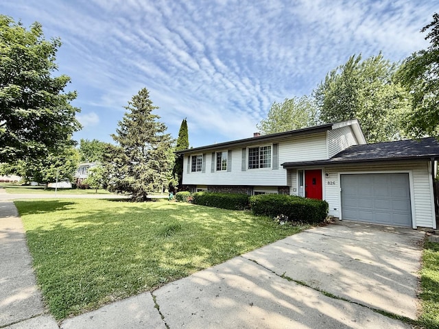 826 Dartmoor Dr, Crystal Lake, IL 60014 - tri-level home featuring a front yard, a garage, and driveway
