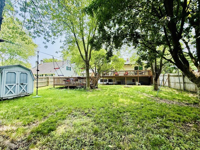 826 Dartmoor Dr, Crystal Lake, IL 60014 - fenced backyard with a storage unit and a deck