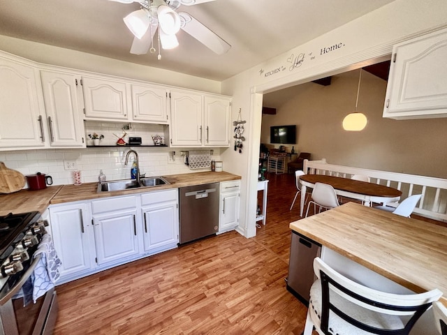 826 Dartmoor Dr, Crystal Lake, IL 60014 - kitchen featuring a sink, appliances with stainless steel finishes, butcher block counters, a ceiling fan, and decorative backsplash