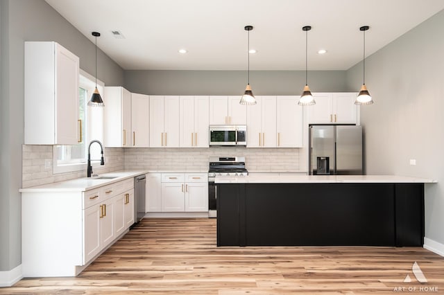 10921 S Hermosa Ave, Chicago, IL 60643 - kitchen with stainless steel appliances, a sink, light wood-style flooring, and recessed lighting