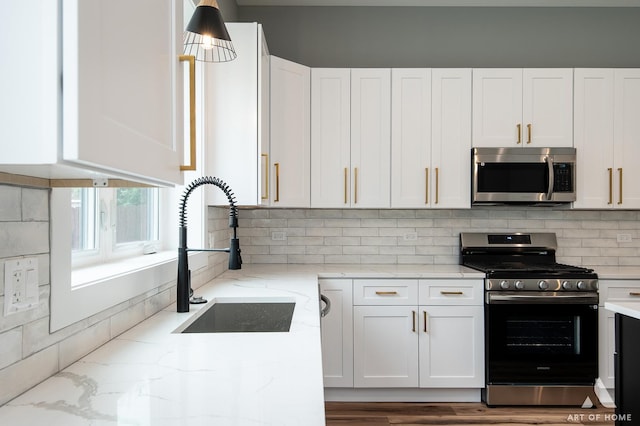10921 S Hermosa Ave, Chicago, IL 60643 - kitchen with stainless steel appliances, a sink, and white cabinetry
