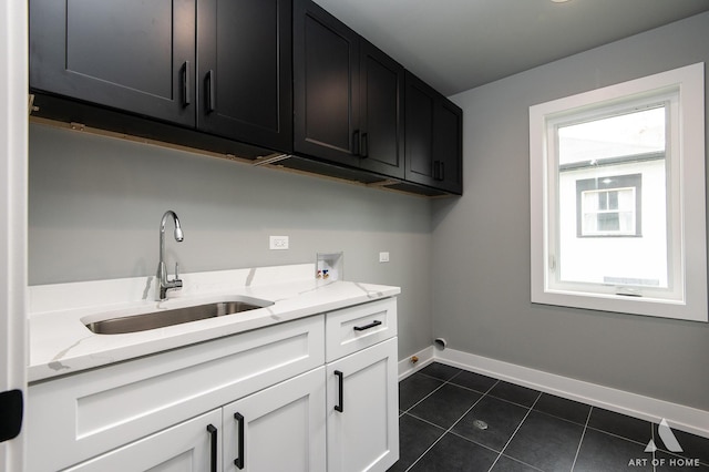 10921 S Hermosa Ave, Chicago, IL 60643 - laundry area with hookup for a washing machine, cabinet space, baseboards, dark tile patterned flooring, and electric dryer hookup