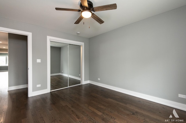 10921 S Hermosa Ave, Chicago, IL 60643 - unfurnished bedroom with dark wood-style floors, baseboards, a closet, and a ceiling fan
