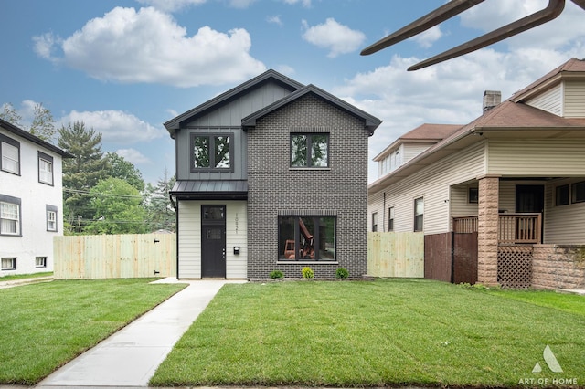 10921 S Hermosa Ave, Chicago, IL 60643 - view of front of house with a standing seam roof, board and batten siding, a gate, and metal roof