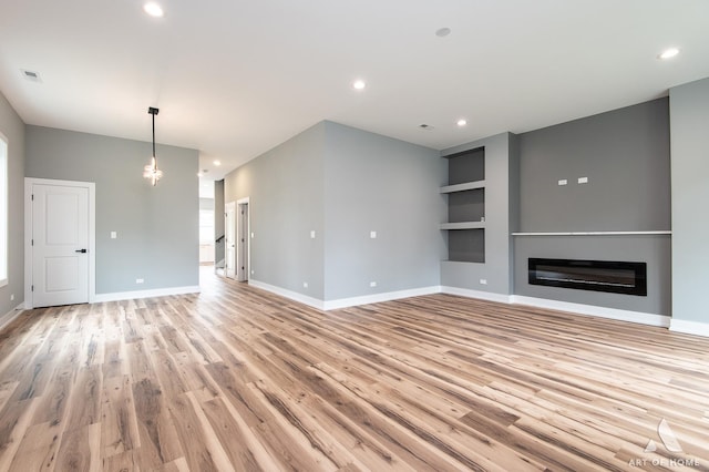10921 S Hermosa Ave, Chicago, IL 60643 - unfurnished living room with light wood-style floors, baseboards, a glass covered fireplace, and recessed lighting