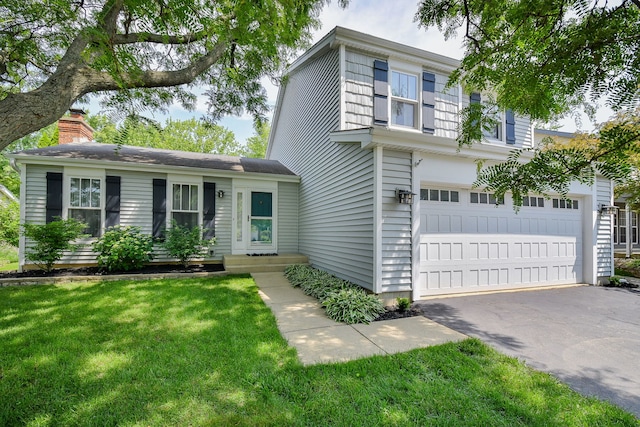 27W108 Walnut Dr, Winfield, IL 60190 - view of front of home featuring a garage, a front yard, asphalt driveway, and a chimney