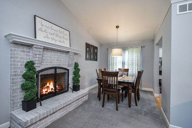 27W108 Walnut Dr, Winfield, IL 60190 - dining room featuring a fireplace, lofted ceiling, and carpet